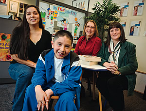 Photo of Rachelle Castillo, Adrien Bong, Karen Kitchen, and Pat Browne, R.N., seated in Anthem Blue Cross of California’s Community Resource Center in Fresno, California.