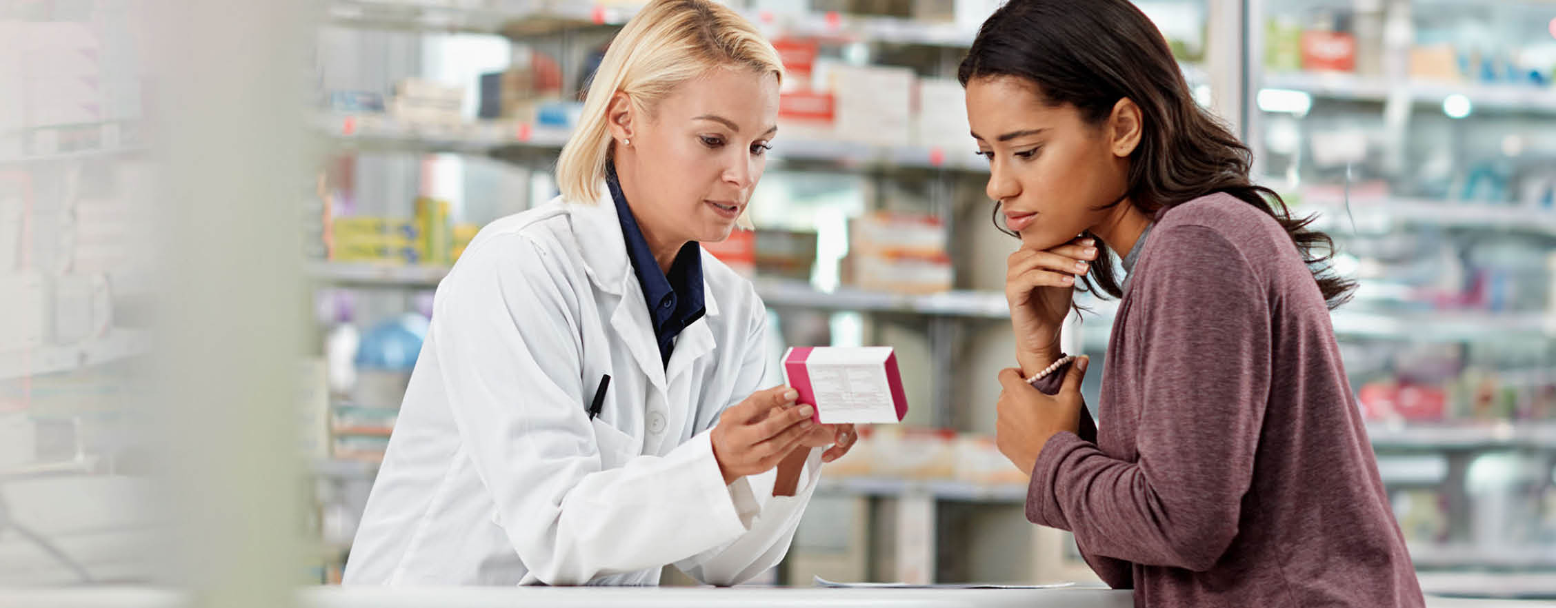 Health plan member consulting with a pharmacist. 