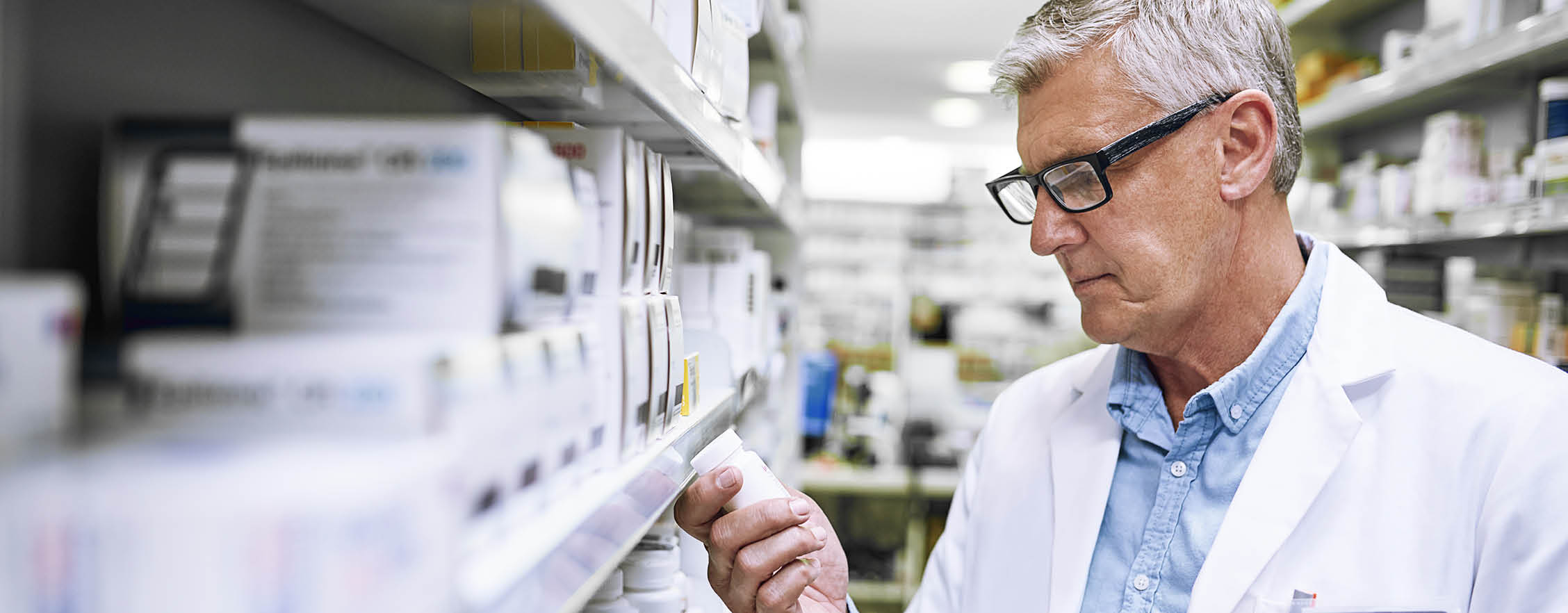 Health plan member consulting with a pharmacist. 